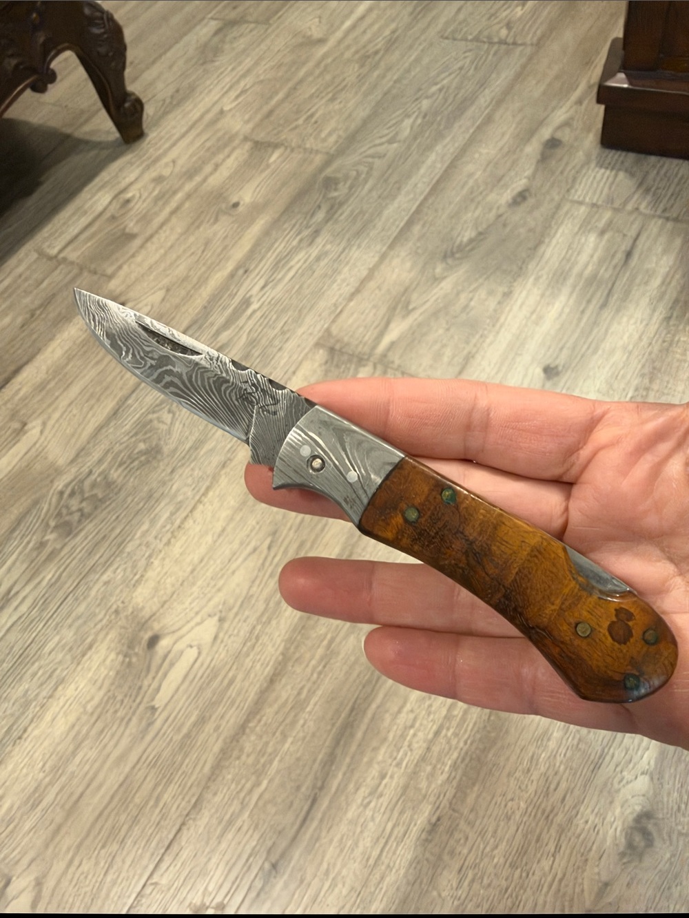 Handheld Damascus Folding Knife with Brown Wood Handle
